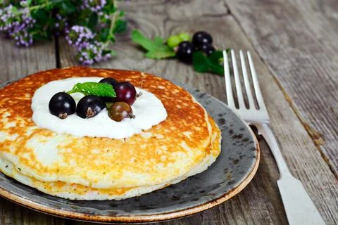 Tasty Pancakes Stack with Back Currant Stock Photos