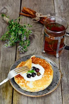 Tasty Pancakes Stack with Back Currant Stock Photos