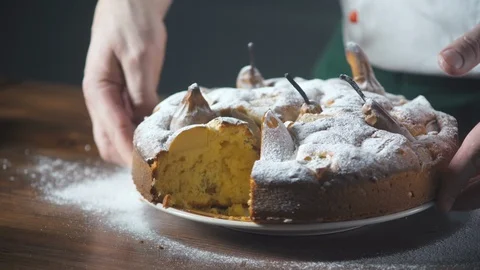 Tasty pear cake in hands of a baker. Pie and bakery. Bake food on cuisine. Stock-Footage 124756018