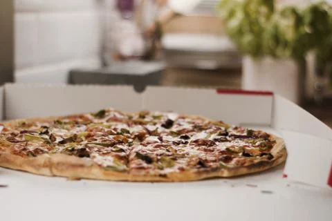 Tasty pizza in the kitchen Stock Photos