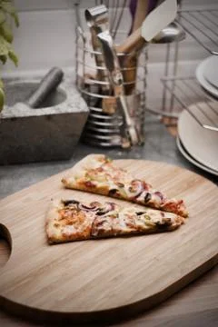 Tasty pizza in the kitchen Stock Photos