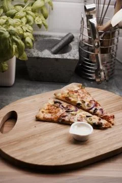Tasty pizza in the kitchen Stock Photos