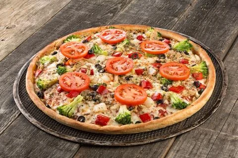 Tasty pizza on the old table Stock Photos