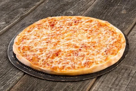 Tasty pizza on the old table Stock Photos