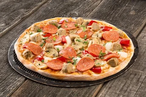 Tasty pizza on the old table Stock Photos