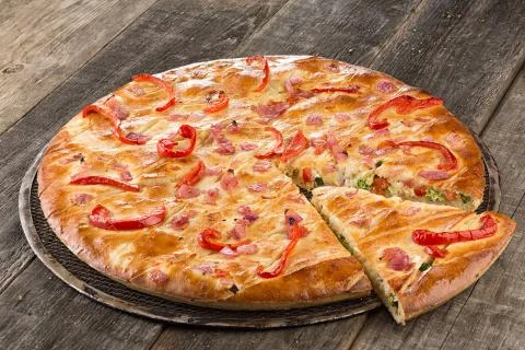 Tasty pizza on the table closed Stock Photos