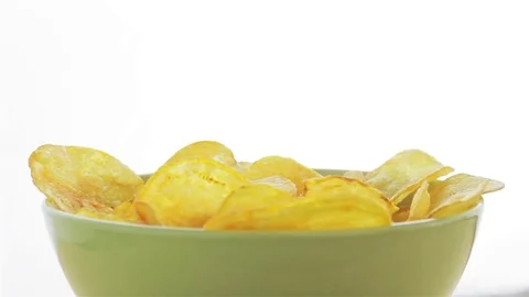 Tasty Potato Chips in platter Rotating looping. Side view. 動画素材 80354875