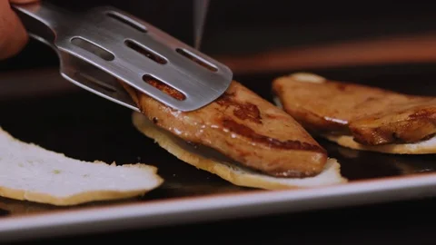 Tasty preparation of the dish puts on the bread meat in restaurant kitchen Stock Footage 100306959