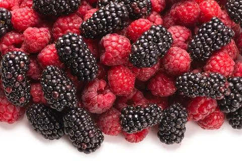 Tasty raspberry and blackberry background. Stock Photos