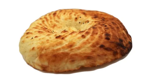 Tasty ready-made beautiful bread pita bread rotates on a white background. 4k Video stock 117673693