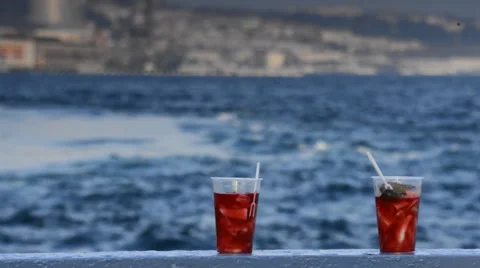 Tasty red tea with a lemon on a background of sea and ships Stockbeeldmateriaal 63044399