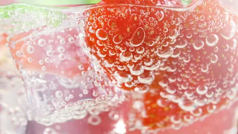 Tasty refreshing strawberry lemonade or mojito cocktail with ice cubes and fresh Stock Footage 168982899