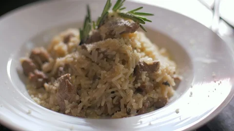 Tasty risotto with veal fillet prepared for two Видео 106935161