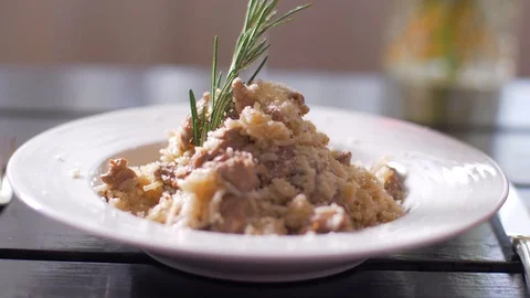 Tasty risotto with veal fillet prepared for two Stock Footage 106935283