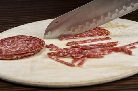 Tasty salami on the table Stock Photos