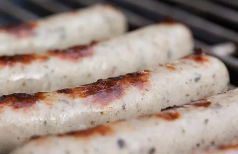 Tasty sausages isolated over solid background Stock Photos