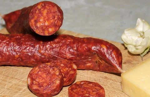 Tasty sausages isolated over solid background Stock Photos