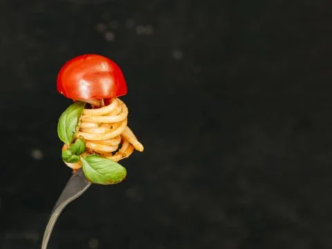 Tasty spaghetti wrapped around fork. High quality and resolution beautiful photo Stock Photos