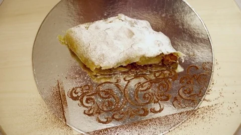 Tasty sweet strudel on the silver plate Stock Footage