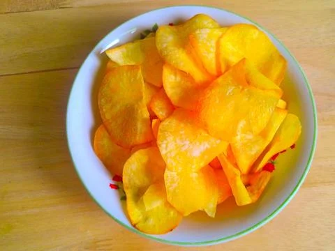 Tasty tapioca chips in a bowl on the table Stock Photos