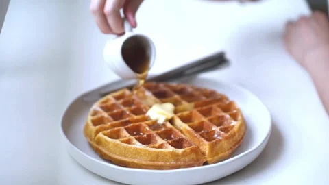 Tasty Waffles with butter and Maple Syrup for brunch. Stock-Footage 336589397