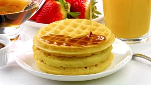 Tasty Waffles with butter and Maple Syrup for brunch. Stock-Footage 336589404