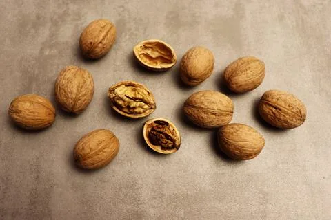 Tasty walnuts on brown table Stock Photos