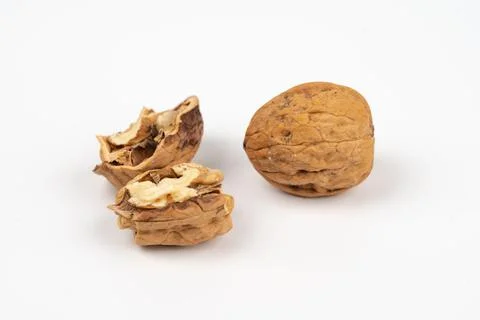 Tasty walnuts falling on white background Stock Photos