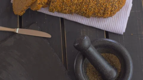 Tasty whole-grain bread on a black background Video stock 109551481