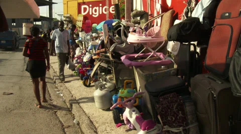 Tat stacked high on sidewalk. Everything for sale. Stock Footage 39358713