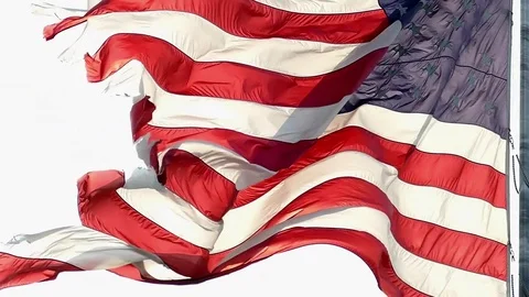 Tattered American Flag, flying free and proud, slow motion Stock Footage