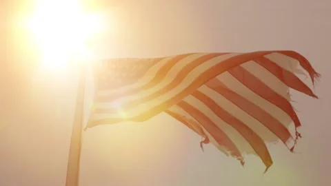 Tattered American Flag with Sun in Background Stock-Footage 159086155