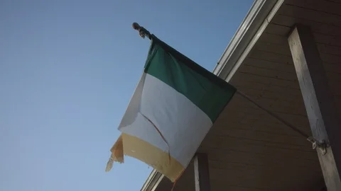 Tattered Irish flag waves in the wind Stock Footage 124327370