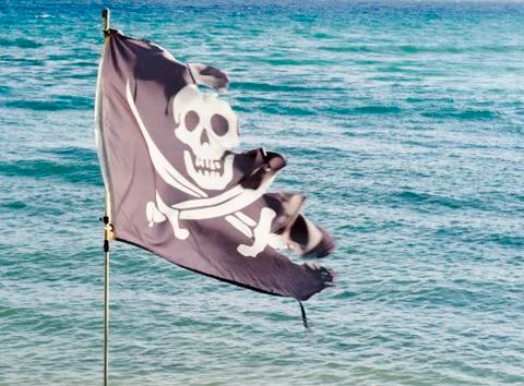 Tattered pirate flag Stock Photos