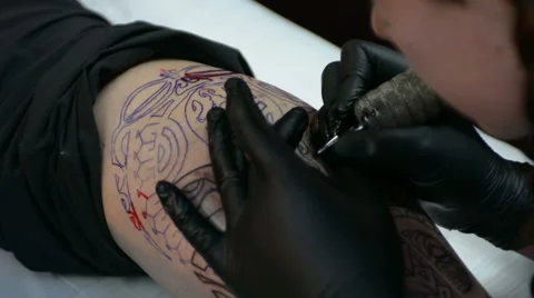 Tattoo artist doing linework Stock Footage 47469727