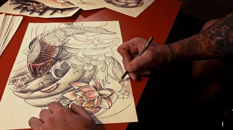 Tattoo-artist draws sketch Stock Footage 52851653