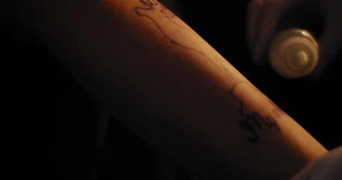 Tattoo artist preparing a drawing on a person's hand for tattooing. BMPCC 4K Stock Footage 125764620