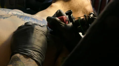 Tattoo artist at work, 4k Stock Footage 63302965