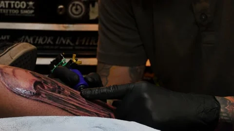 Tattoo artist at work Stock Footage 48434983