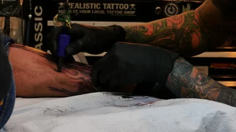 Tattoo artist at work Stock Footage 48435235
