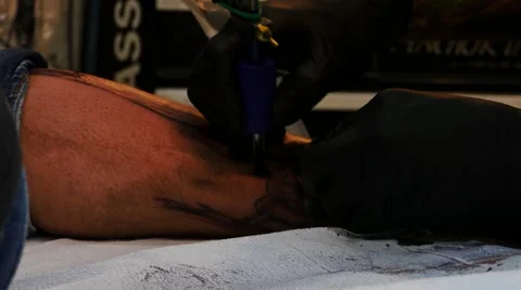 Tattoo artist at work Stock Footage 48435289