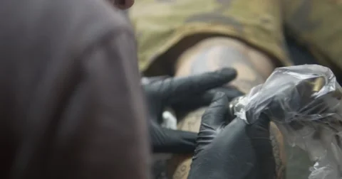 Tattoo artist working Stock Footage 67503941