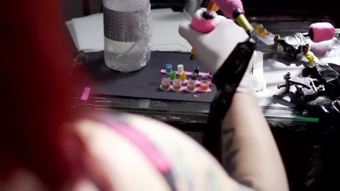 Tattoo artist working Stock Footage 194455212