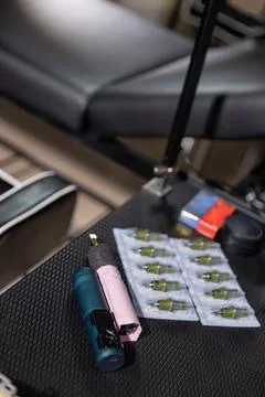 Tattoo artist's workspace featuring tools and supplies ready for an appoint.. Stock Photos