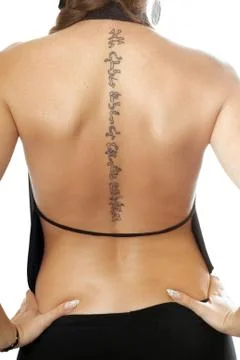 Tattoo on the back Stock Photos