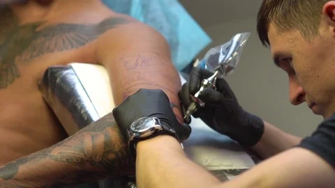 Tattoo on the hand process applying ink to the skin Stock Footage 81562376