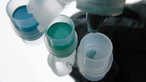 Tattoo ink in small jars Stock Footage 195961399