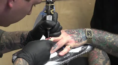 Tattoo on left hand finger Video stock 10604904