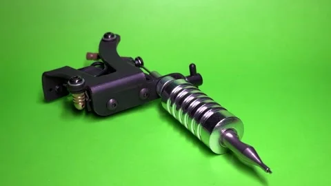 Tattoo Machine on Green Background Stock Footage 303382637