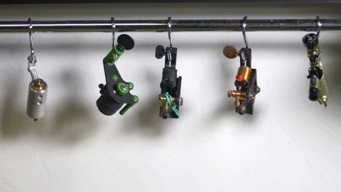 Tattoo machine hanging on bar. Stock Footage 70532546
